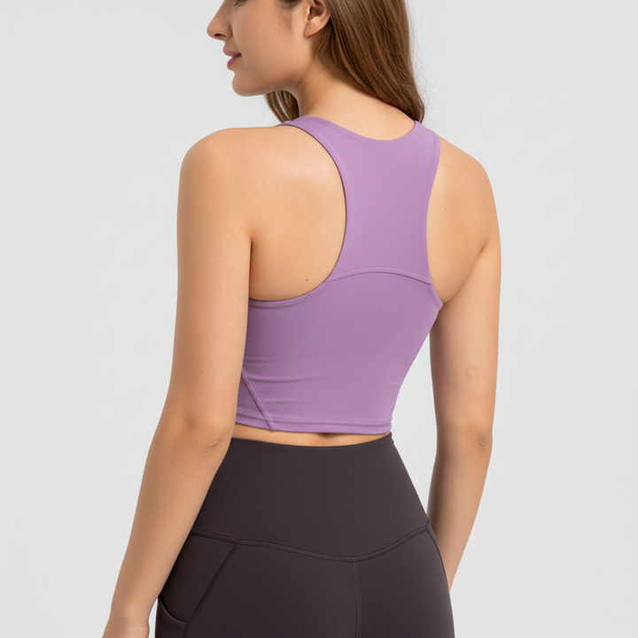 Seamless women's athletic top, moisture-wicking, with comfortable padded support for workouts.