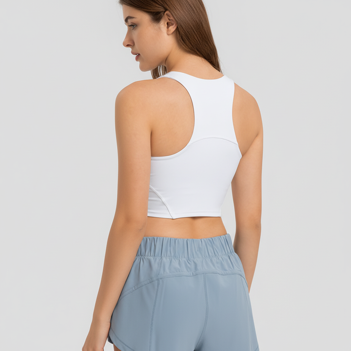 Versatile women's gym clothing: supportive sports top with removable pads & racerback style.