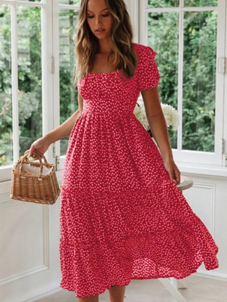 Flowy women's Sweet Meadow floral maxi dress featuring beautiful puff sleeves & a relaxed summer fit.