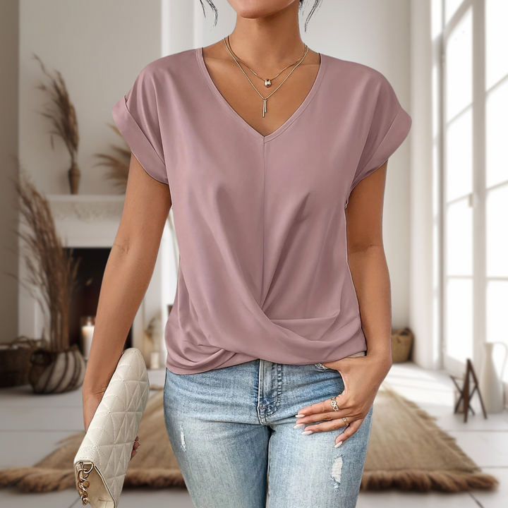 Close-up of a women's flattering sweetheart neckline on a short sleeve casual top, ideal for summer fashion.