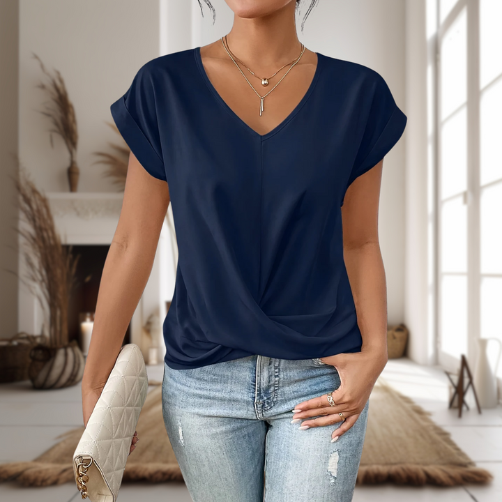 Soft fabric detail of a women's sweetheart neck t-shirt, a breathable short sleeve top for casual wear.