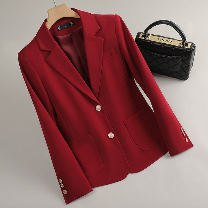White women's tailored blazer. Effortless professional style & smart casual wear. Elegant structured outerwear.