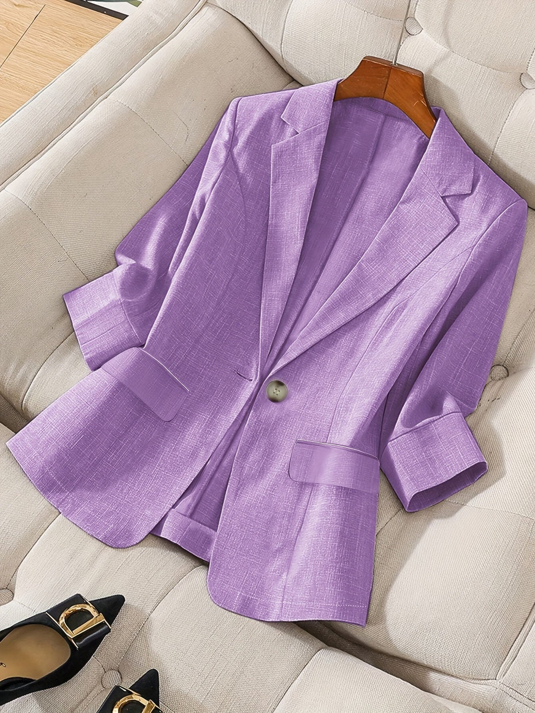 Women's tailored cropped blazer for a chic business casual look.