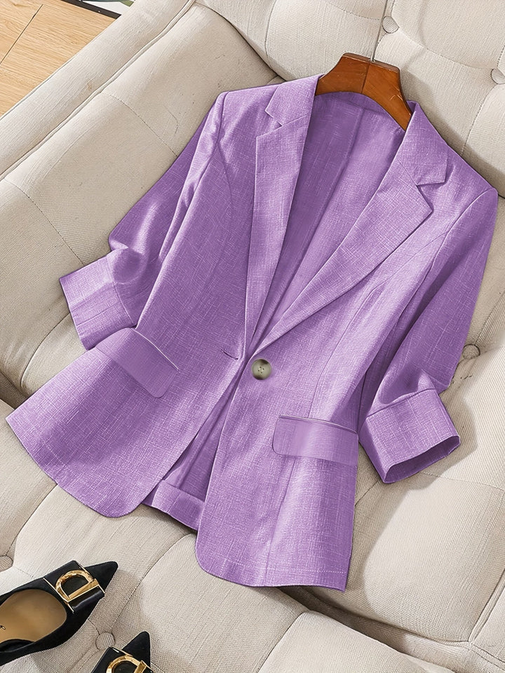 Women's tailored cropped blazer for a chic business casual look.