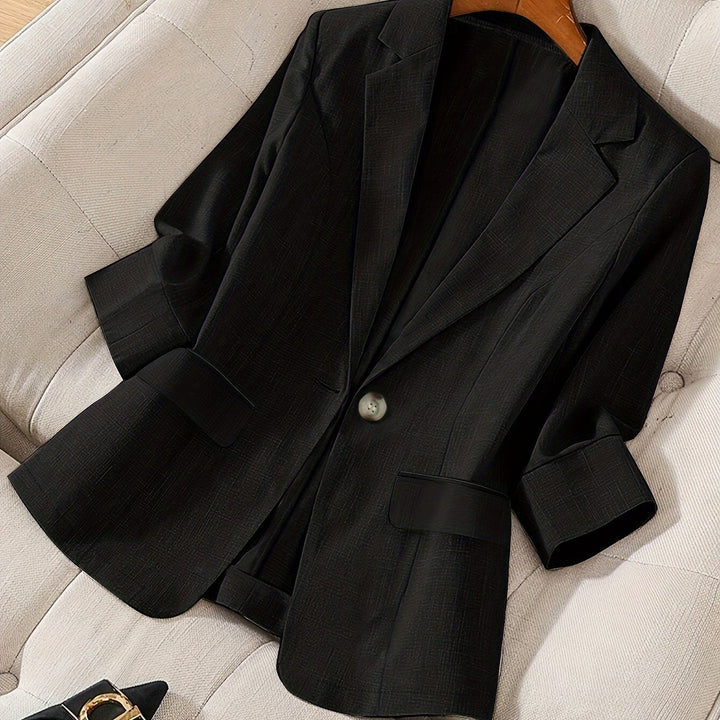 Women's elegant tailored blazer, cropped style, perfect for versatile outfits.