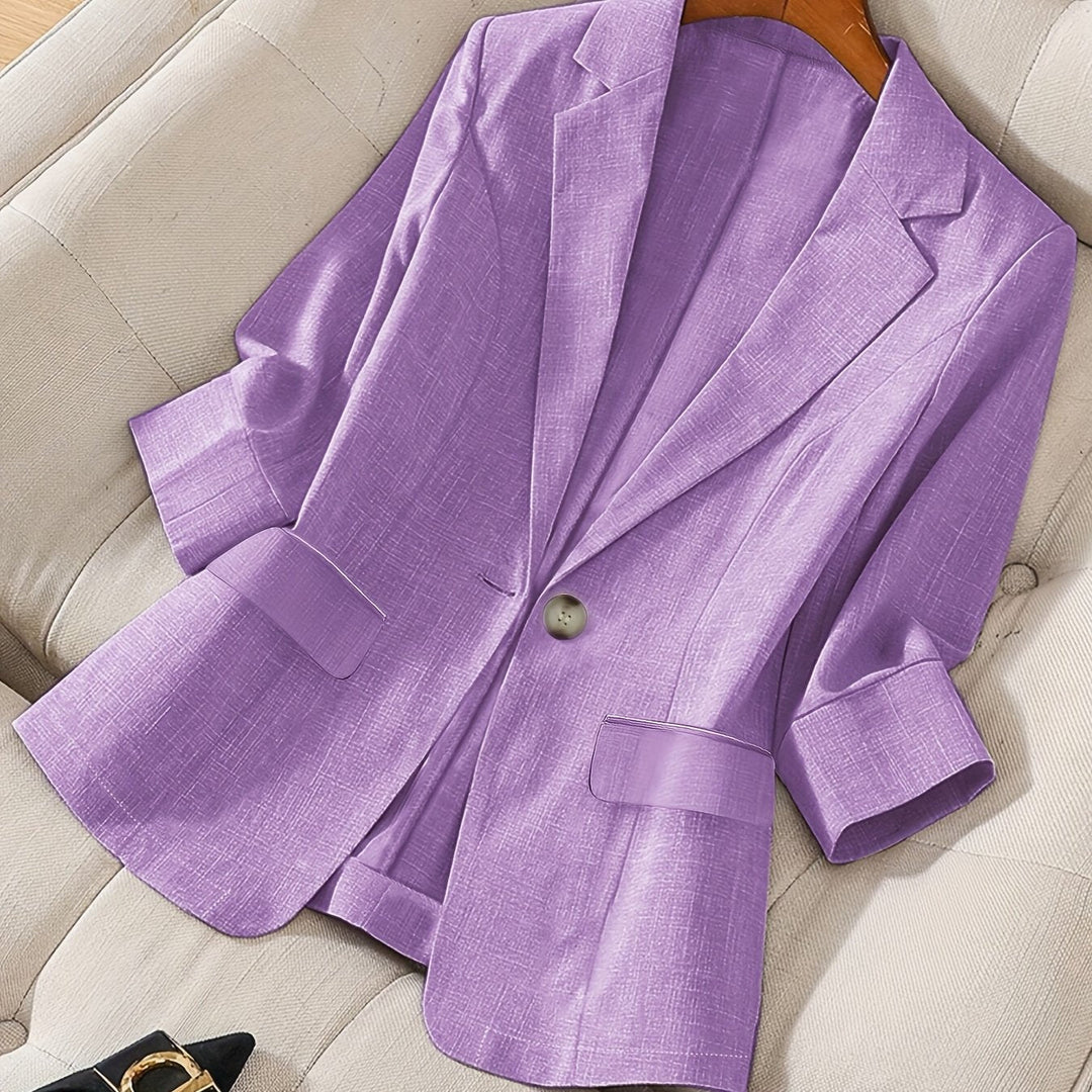 Modern women's tailored cropped jacket, essential for versatile business casual.