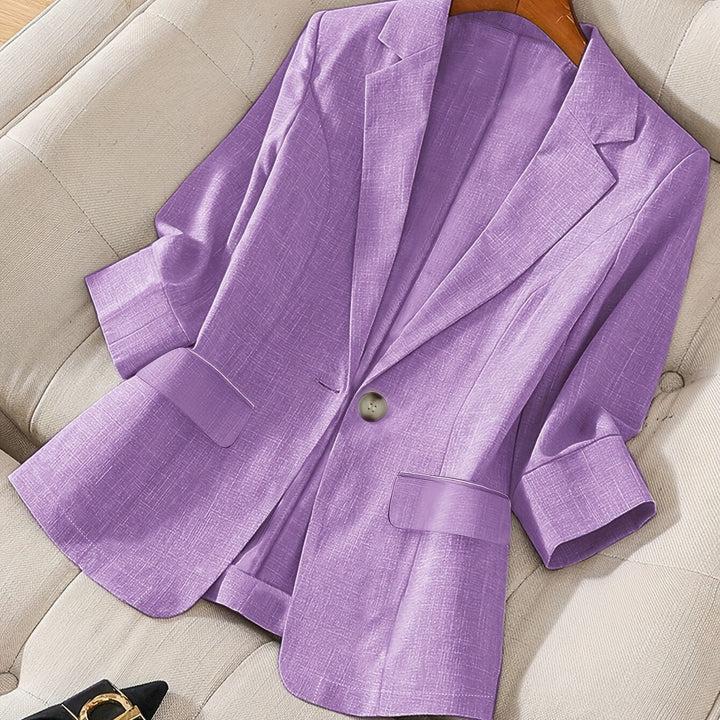 Modern women's tailored cropped jacket, essential for versatile business casual.
