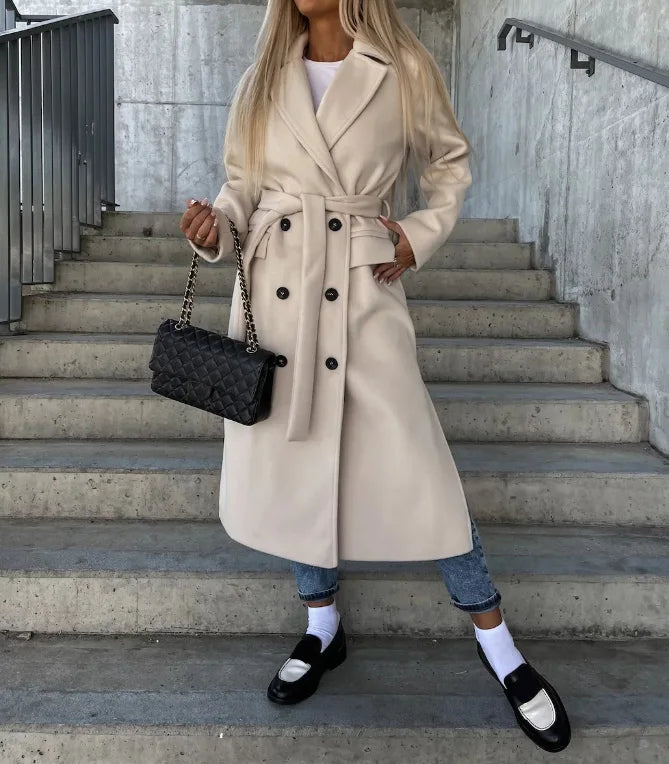 Women's tailored long coat with belt, structured fit, ideal for office elegance. Professional fall winter outerwear.