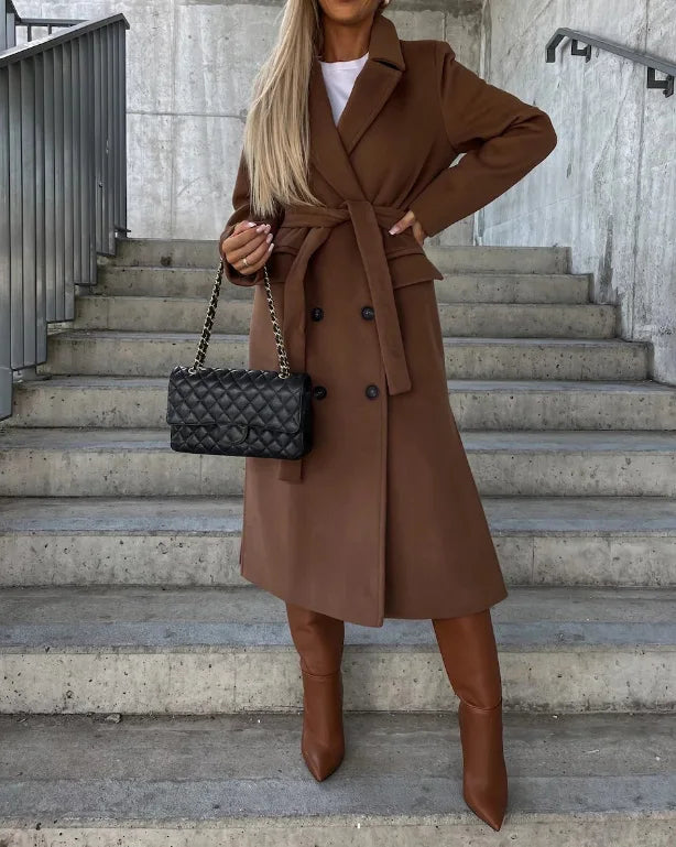 Elegant women's long tailored coat, belted for a professional and versatile office style. Perfect fall winter fashion.
