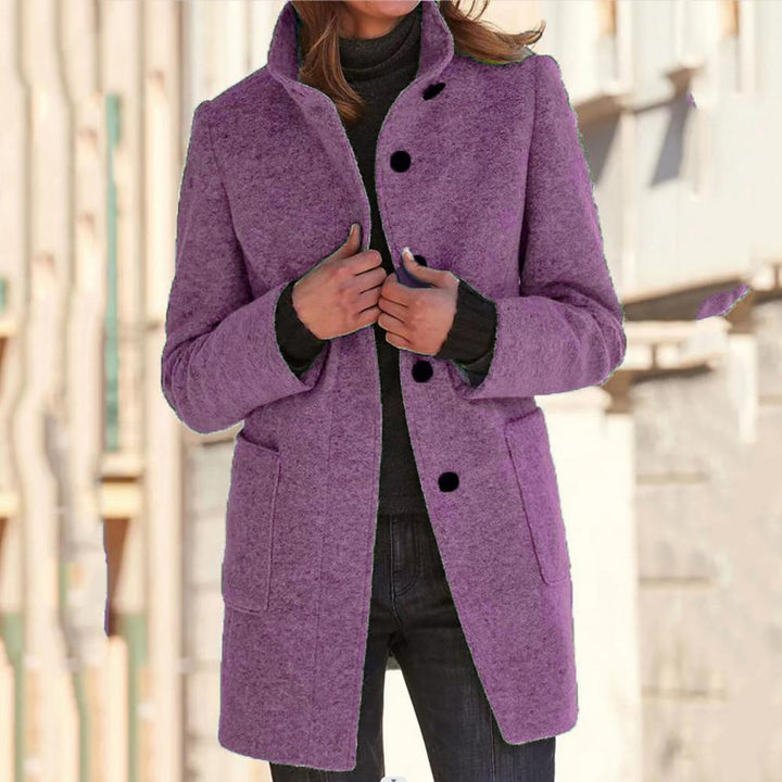 Elegant women's tailored mid-length coat with refined button closure. Sophisticated fall fashion & winter style outerwear.
