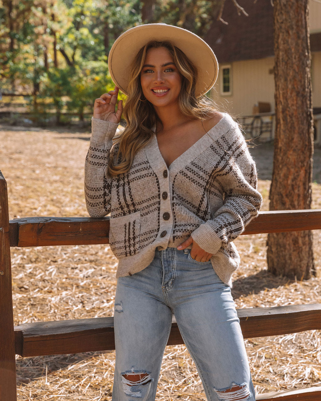 Chic women's tailored plaid button-front vest, ideal for smart casual fall fashion layering.