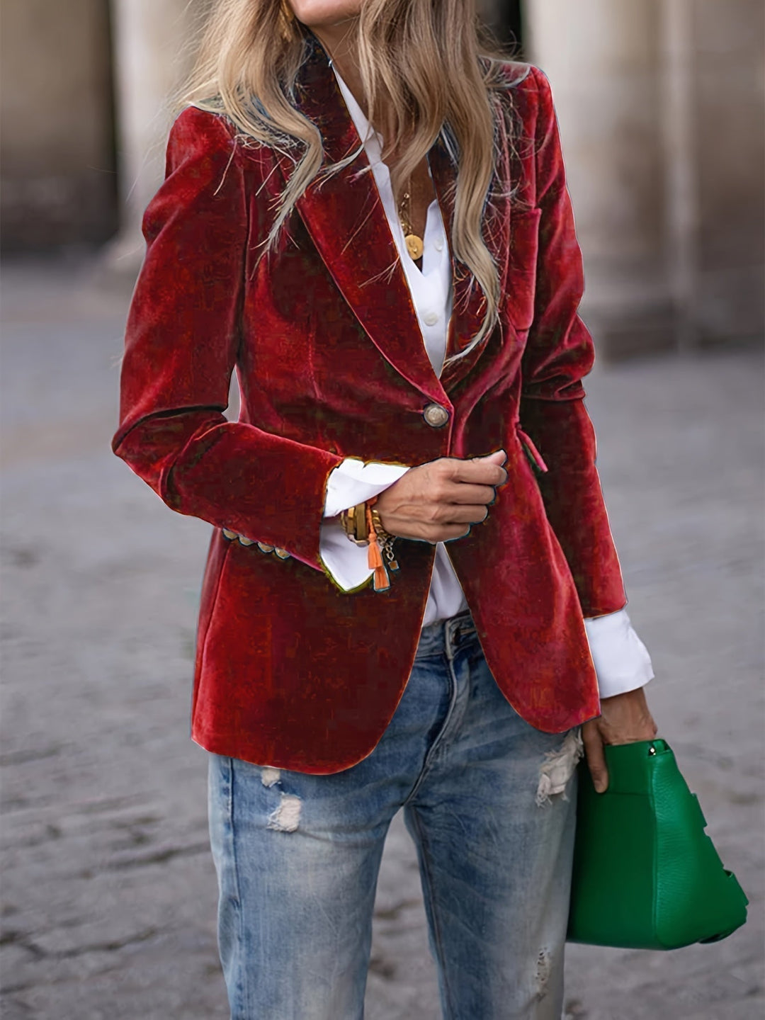 Women's tailored velvet blazer with elegant gold buttons, perfect for office or formal wear.