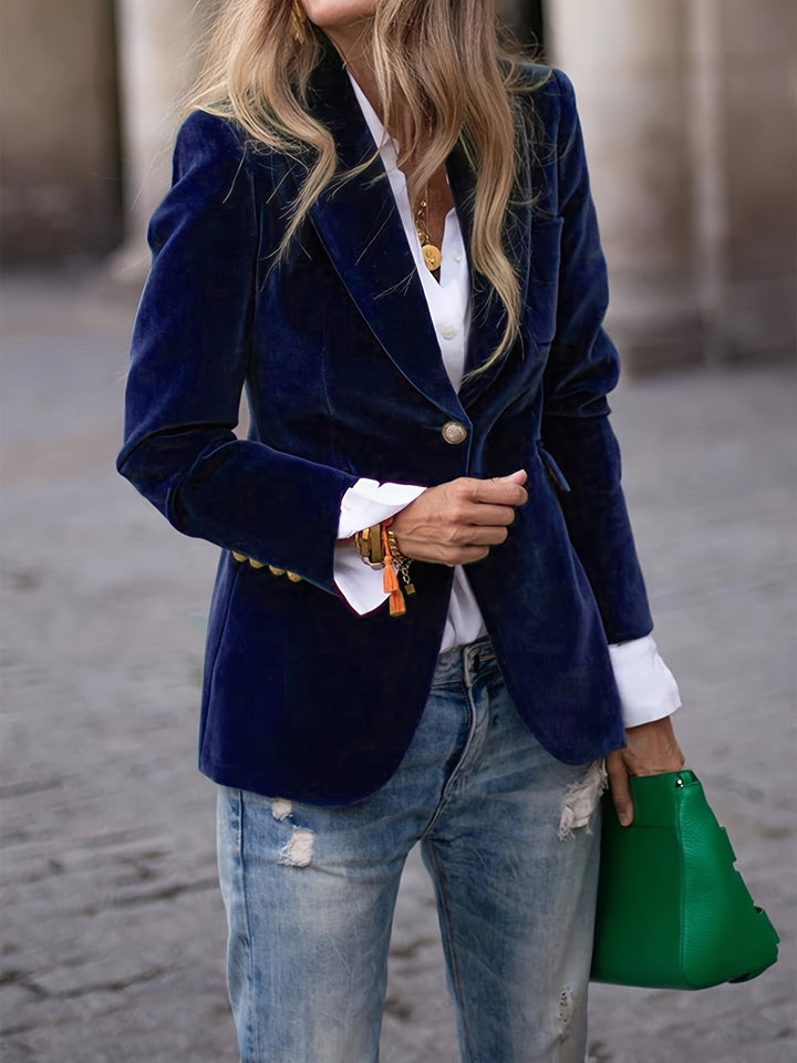 Statement women's fashion blazer, tailored in velvet with elegant gold buttons for a chic look.