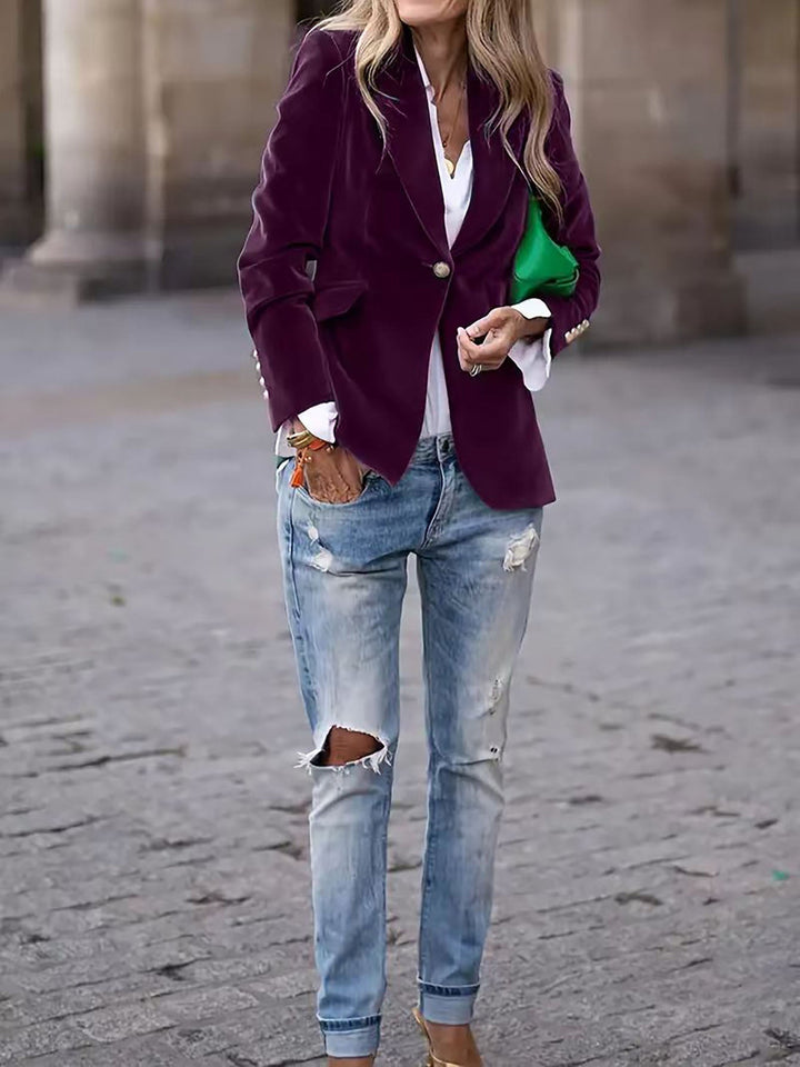 Women's elegant long-sleeve tailored velvet blazer featuring distinctive gold buttons, ideal for business attire.