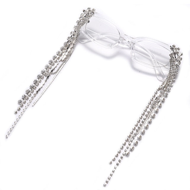 Close-up of dazzling rhinestone women's sunglasses with stylish tassels and UV400 protection.