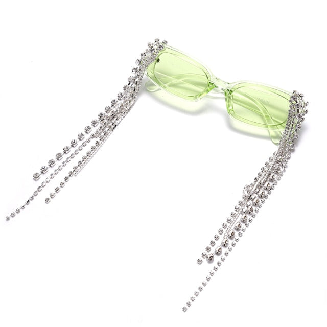 Sparkly women's rhinestone sunglasses, adorned with tassels, offering UV400 gradient lens protection.