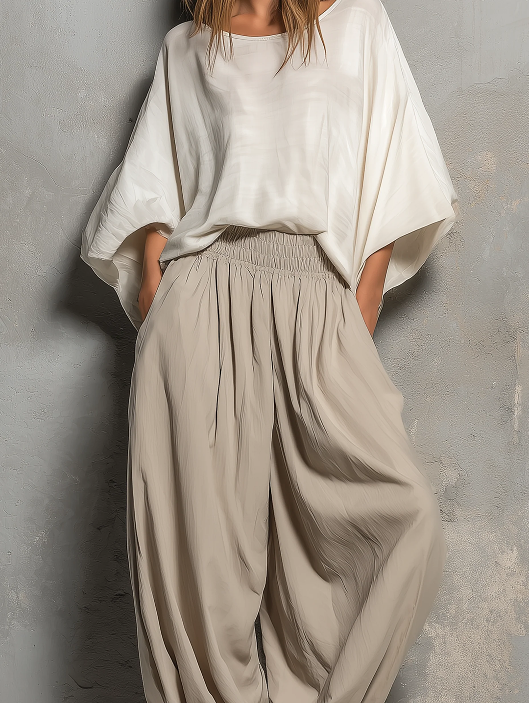 Flowing women's taupe high waist harem pants with a wide leg. Comfortable & stylish, embodying a relaxed boho vibe.