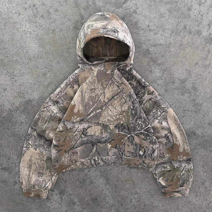 Unisex fit Women's Terrain Camo Zip Jacket, perfect for a layered urban street style or outdoor activity.