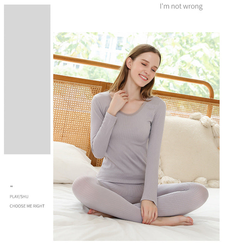 Women's thermal underwear set, purple, providing warmth and shaping.