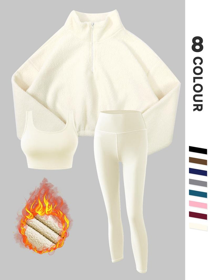 Soft fleece 3-piece women's outfit with thermal leggings & top, designed for warmth and movement.