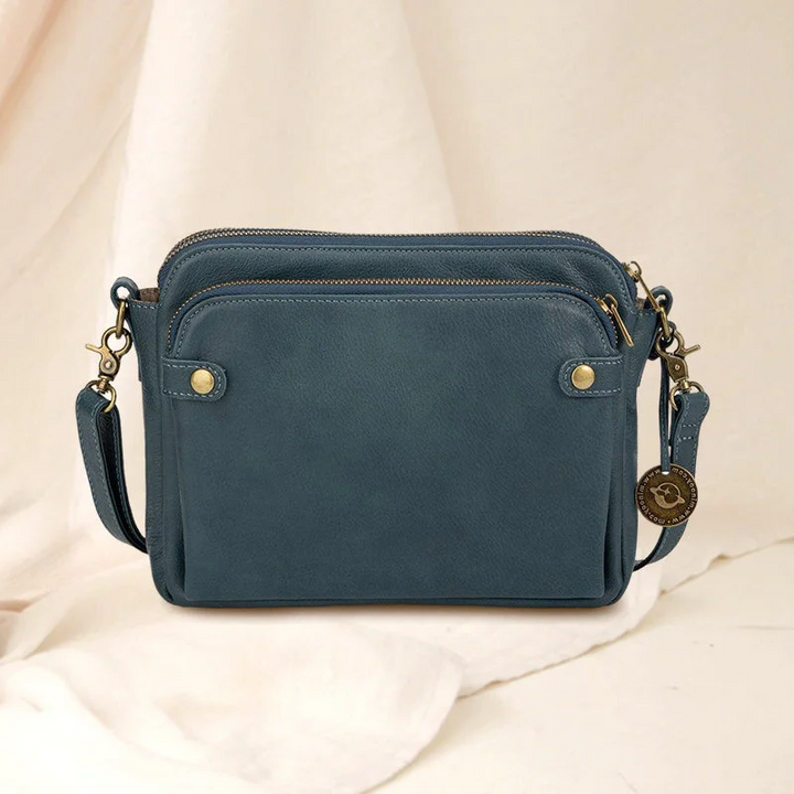 Durable women's PU leather multi-compartment bag. Three-layer design for secure crossbody, shoulder, or clutch wear.