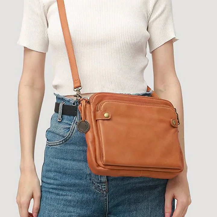 Versatile women's three-layer PU leather travel purse, easily converts from crossbody to shoulder or clutch.
