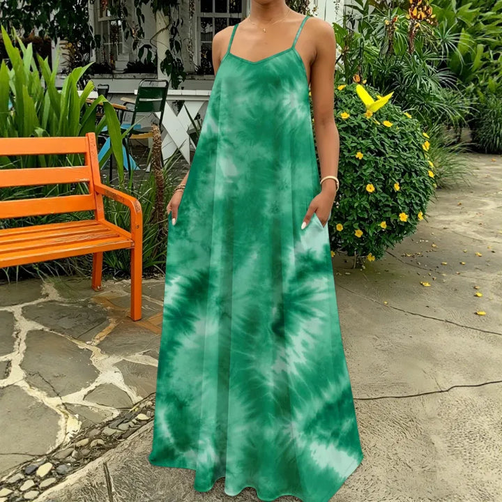 Effortless flowy tie-dye strappy maxi dress for women. Sleeveless V-neck design, ideal for casual summer or vacation style.
