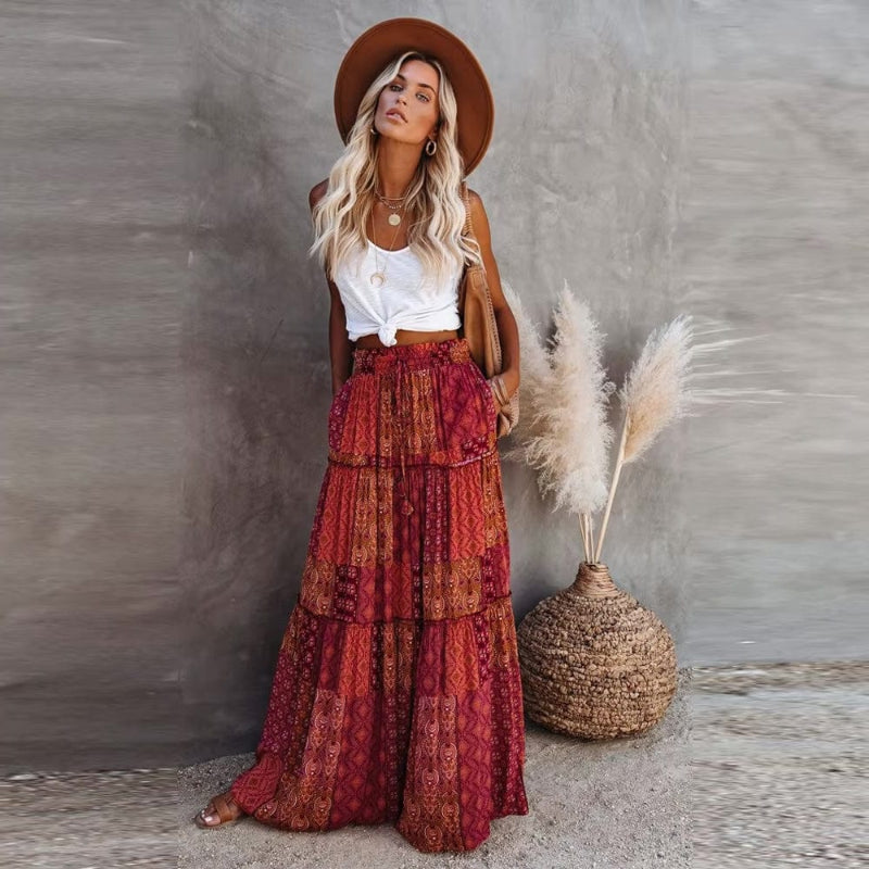 Flowy bohemian tiered floral maxi skirt for women, high elastic waist, ideal for summer vacation.
