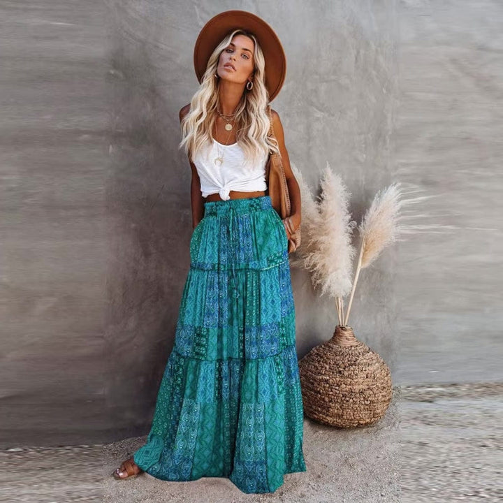 Vibrant floral print tiered maxi skirt for women, high elastic waist, flowy summer vacation look.