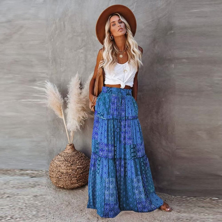 Long women's tiered floral maxi skirt with high elastic waist, bohemian, great for summer fashion.