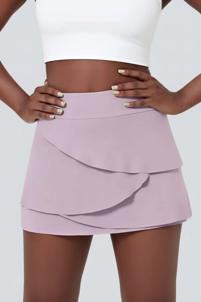 Performance women's golf skort with tiered design for effortless movement & comfort in activewear.