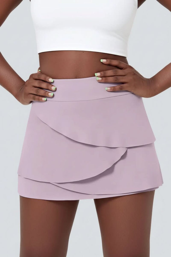 Performance women's golf skort with tiered design for effortless movement & comfort in activewear.