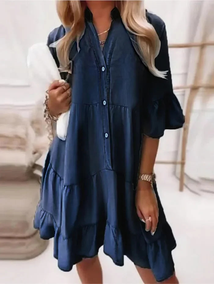 Light blue women's v-neck tiered mini dress featuring ruffles and button detail, ideal for summer outfits.