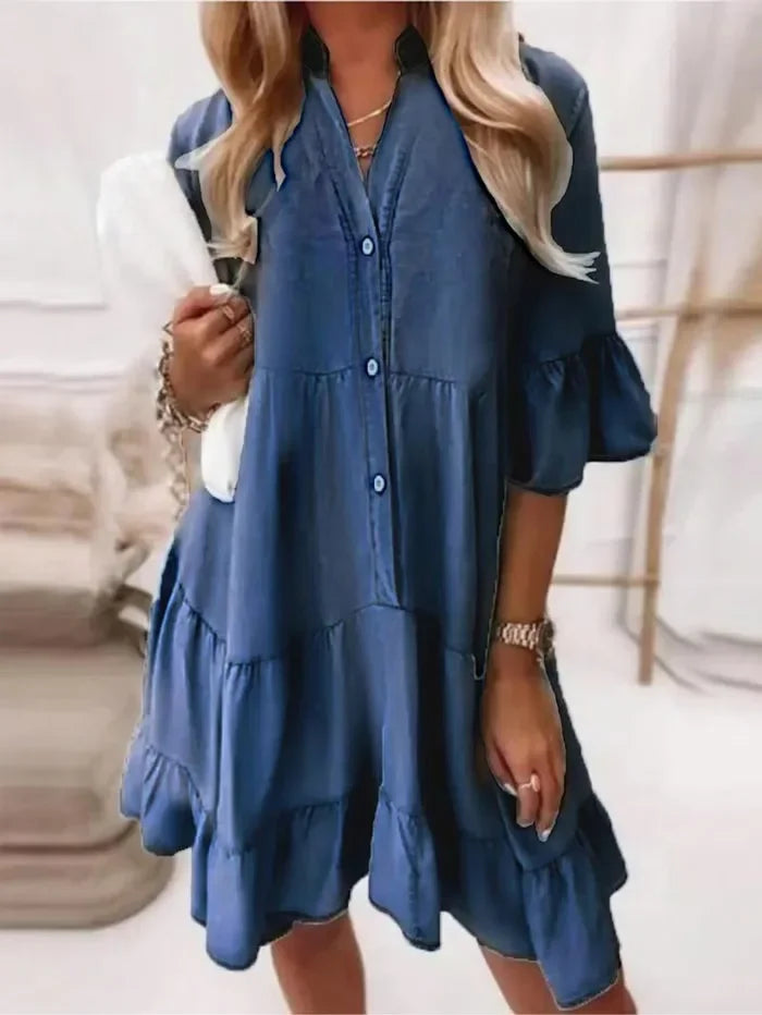 Casual women's tiered ruffle mini dress. Features button-down front and flattering fit, great for warm weather.