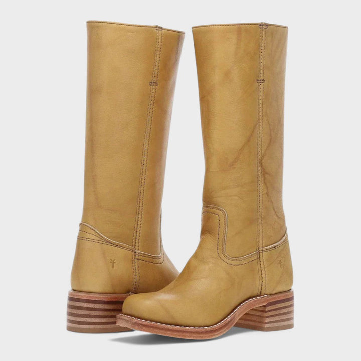 Stylish dark brown knee-high women's boots, comfortable for riding or everyday wear, a versatile choice for fall and winter.