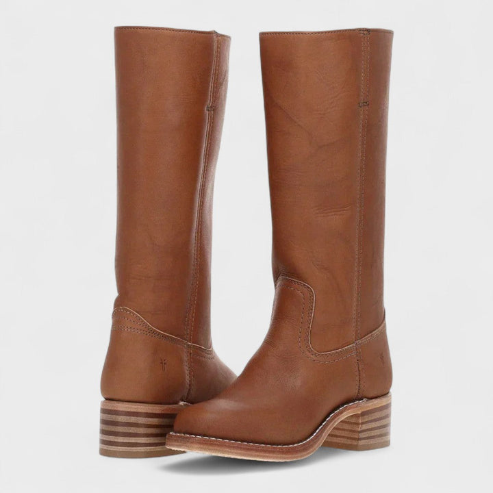 Timeless women's equestrian boots, a classic knee-high design with a sturdy block heel, ideal for riding and winter style.
