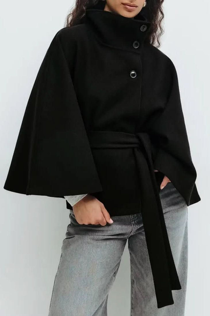Women's timeless self-tie cape, oversized fit. Elegant outerwear for versatile layering.