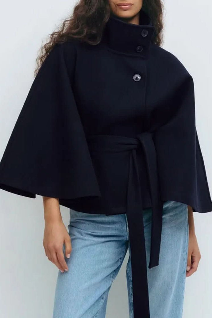 Solid color women's self-tie cape. Elegant oversized fit for modern sophisticated style.