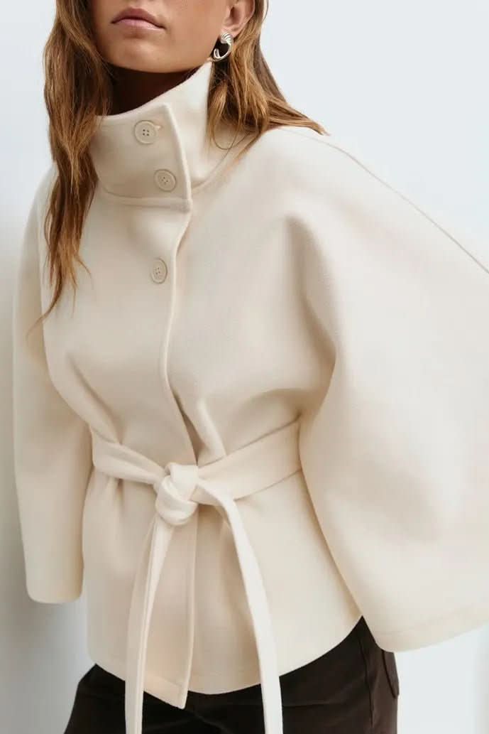 Women's elegant self-tie cape, oversized fit. Fashionable outerwear for chic and versatile layering.