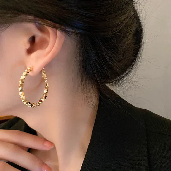 Chic faceted hoop earrings for women, offering timeless elegance and everyday wearability.