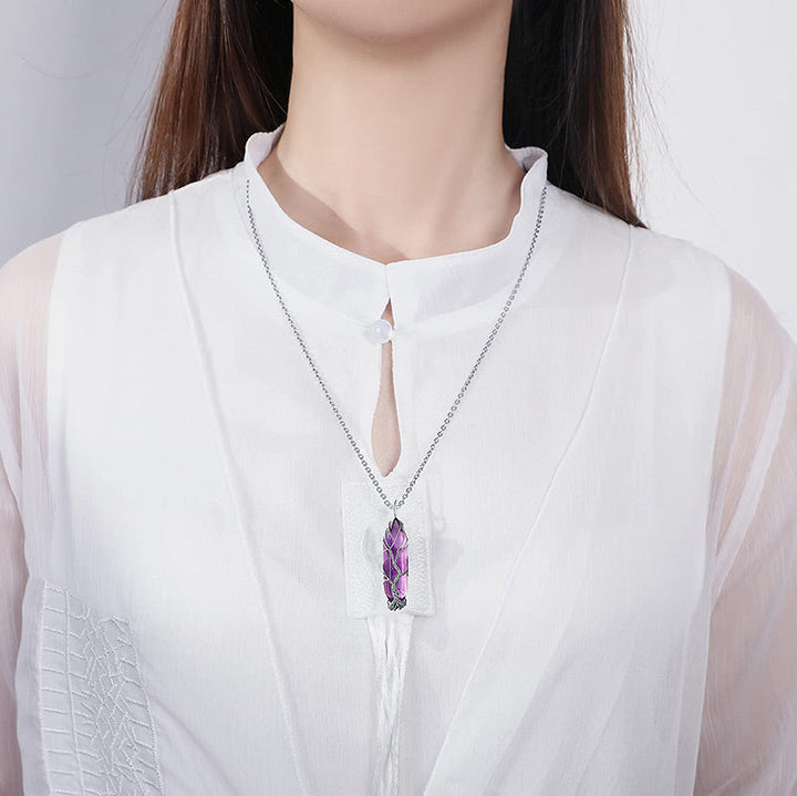 Delicate Tree of Life crystal gemstone necklace, a meaningful spiritual accessory.