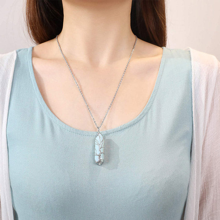 Women's meaningful gift: Tree of Life necklace with crystal and healing gemstone.