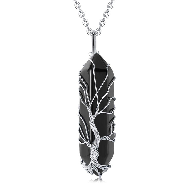 Women's spiritual gemstone necklace, Tree of Life, with a clear healing crystal.