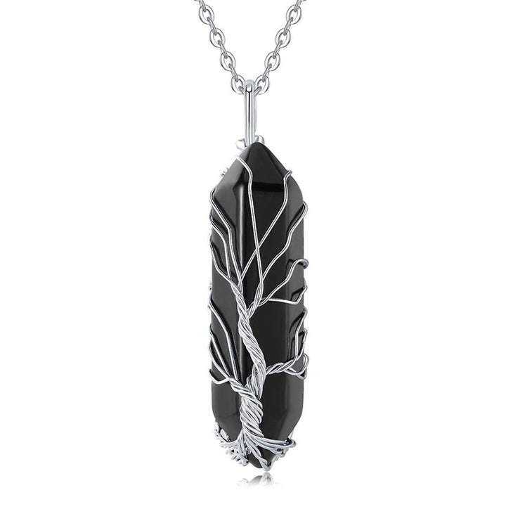 Women's spiritual gemstone necklace, Tree of Life, with a clear healing crystal.
