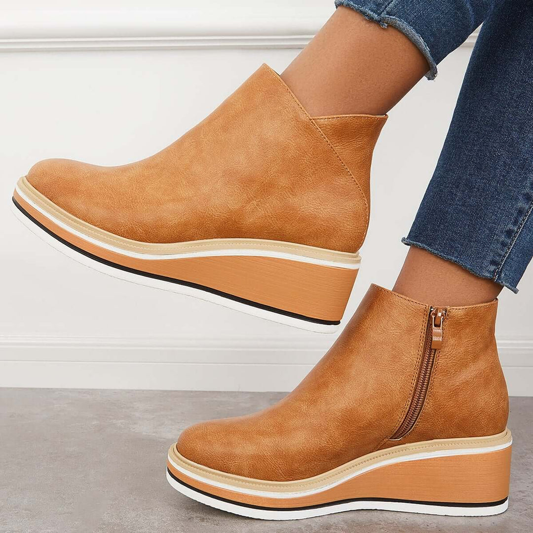 Women's fashionable ankle boots with a trendy platform & functional zipper for easy wear.