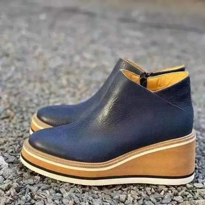Elegant women's platform ankle boots, designed with a sleek zipper for a dressy touch.