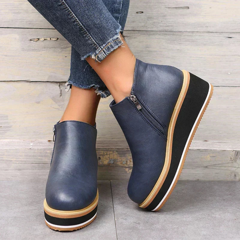 Fashionable women's fall boots: trendy ankle cut with a durable platform & stylish zipper.
