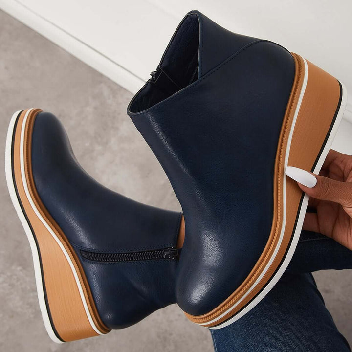 Women's everyday platform ankle boots with a zipper, blending comfort with trendy style.