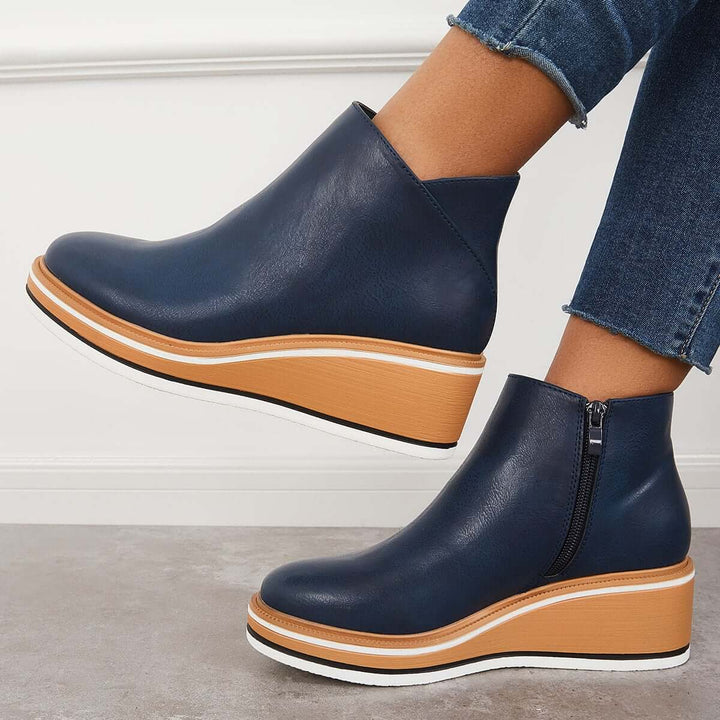Chic women's zipper ankle boots, featuring a platform sole for added height & fashion.