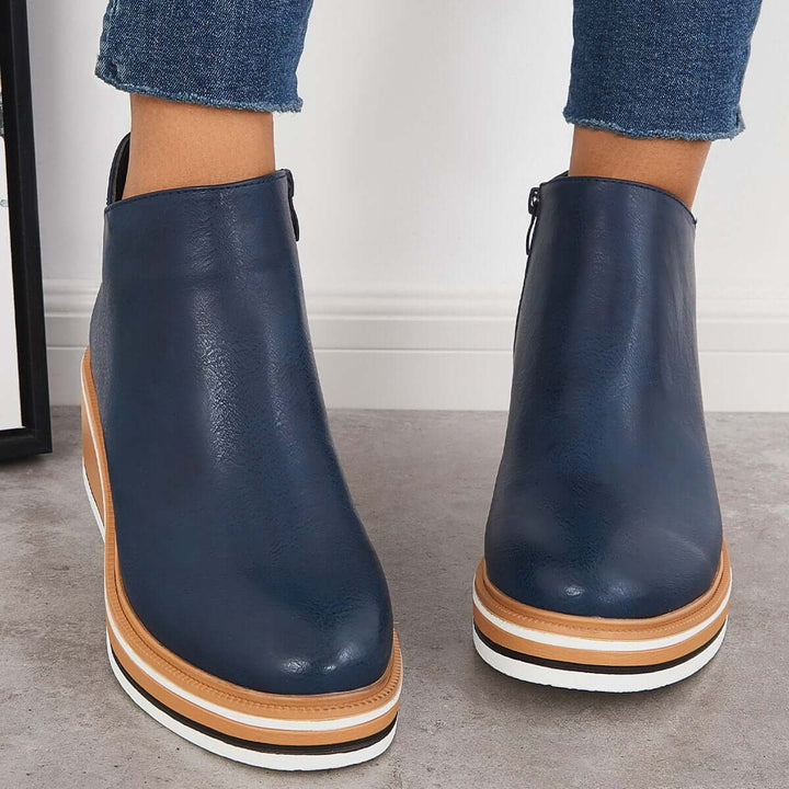 Modern women's platform boots: ankle-high, trendy design with a convenient zipper closure.
